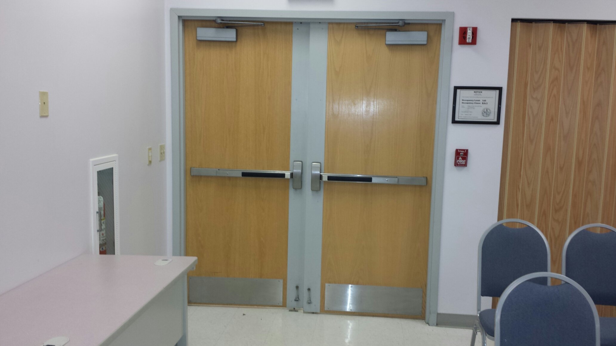 Wooden Fire Doors with emergency exit bars and closers