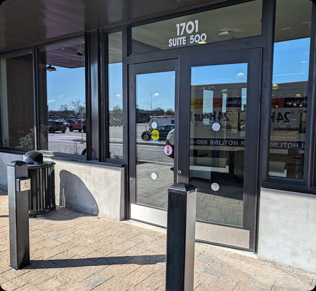 Newly installed glass storefront commercial door in Buffalo, NY by A 24 Hour Door, providing professional commercial door services.
