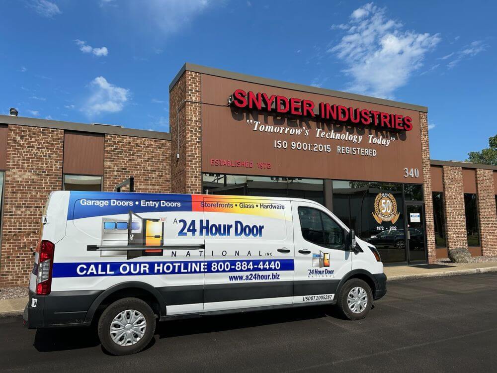 A 24 Hour Door service van providing commercial door services in Buffalo, NY. The vehicle highlights offerings including storefronts, entry doors, and hardware for local businesses.